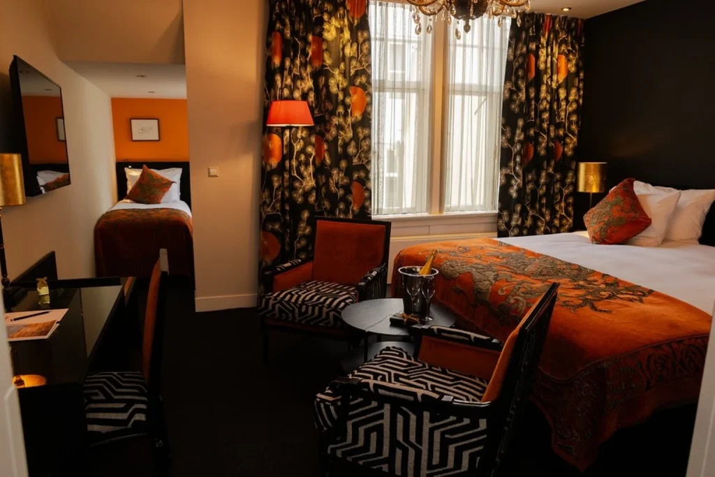 Luxury room with king bed and elegant sitting area at Ambassade Hotel in Amsterdam