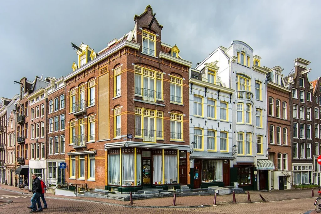 Historic canal-side hotel exterior at Amsterdam Wiechmann Hotel in Amsterdam.