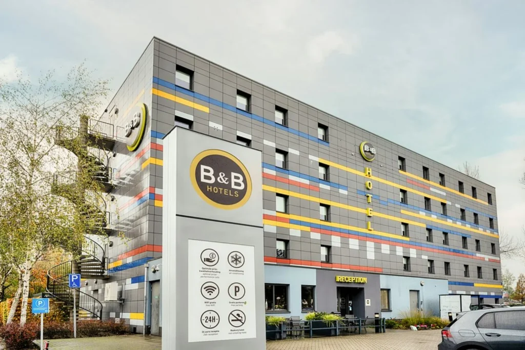 Colorful modern hotel exterior with B&B Hotels signage and main reception entrance, B&B Hotel Amsterdam-Zaandam, Zaandam
