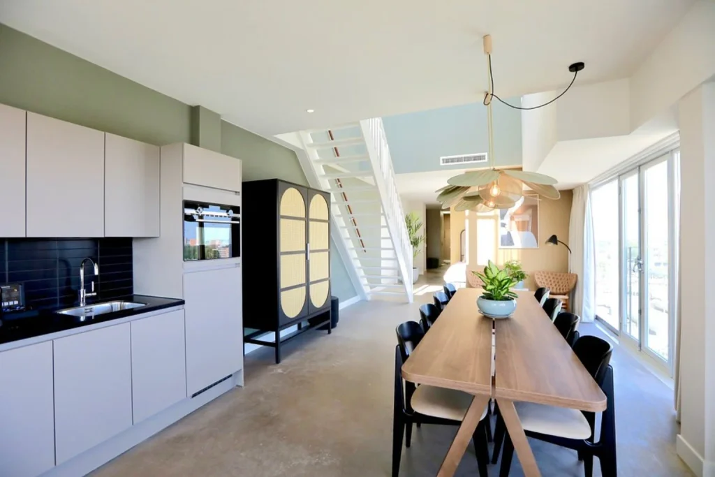 Spacious apartment at Cityden BoLo District Amsterdam featuring a modern kitchen, dining area and contemporary interior design