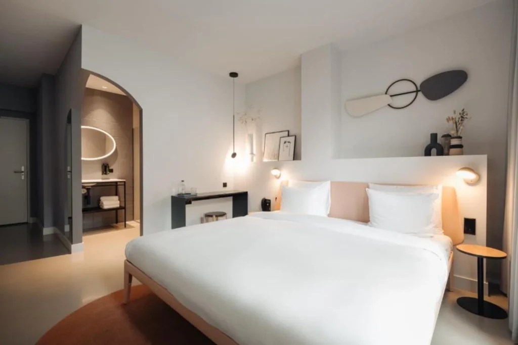 Modern guest room with double bed at Conscious Hotel Museum Square in Amsterdam, Netherlands