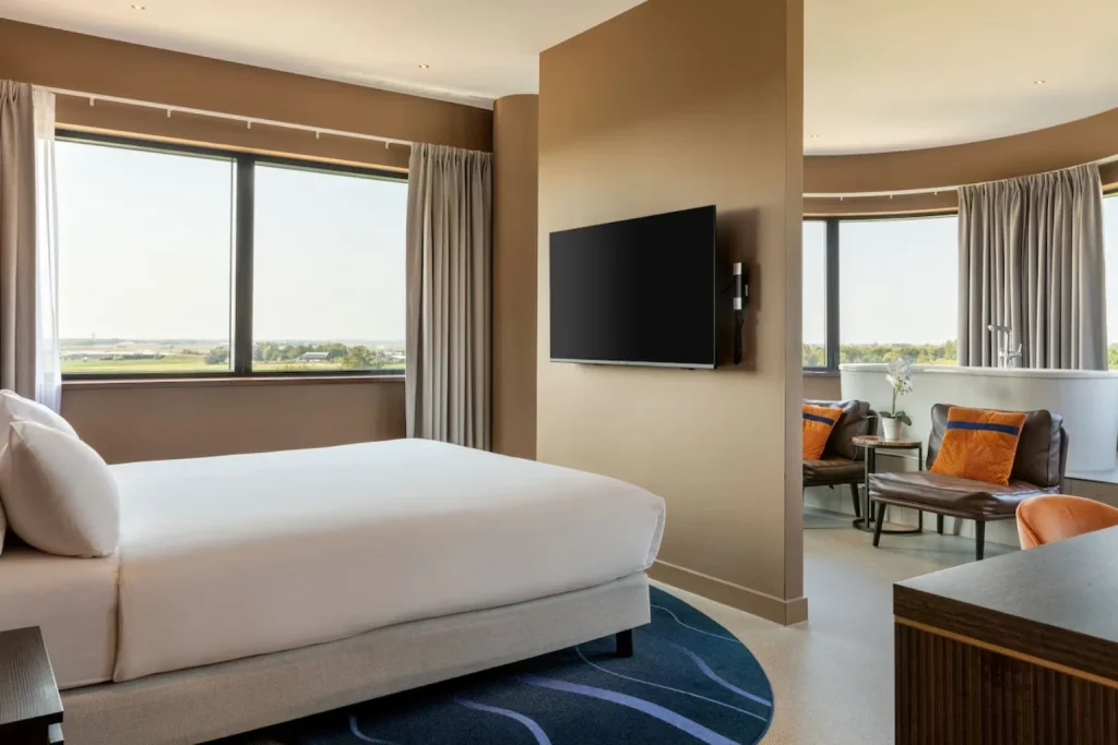 Spacious bedroom and living area at Corendon Apartments Schiphol