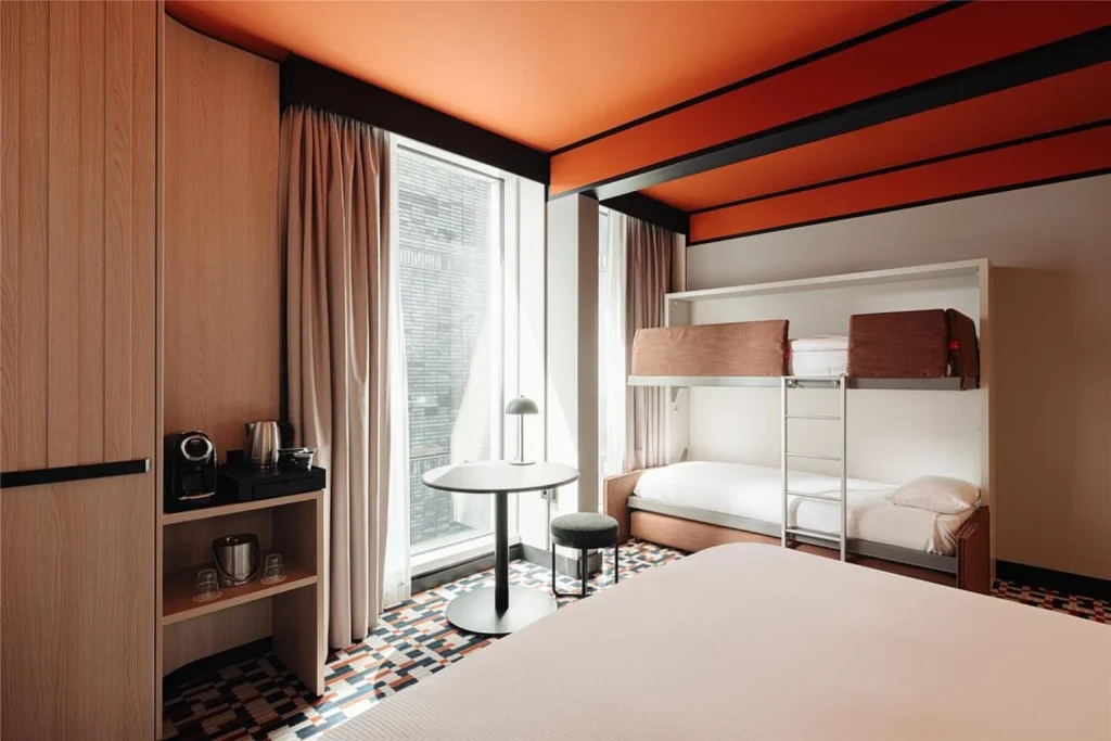 Family room with double bed and bunk bed at DoubleTree by Hilton Amsterdam Centraal Station