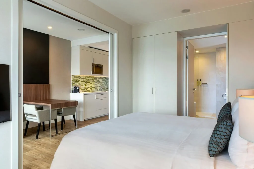Spacious apartment-style room with a separate kitchen, dining area and modern bedroom at Element Amsterdam, Amsterdam.