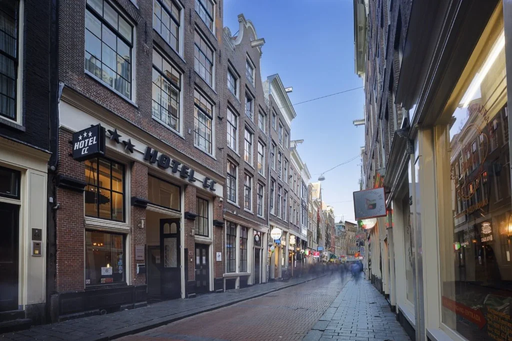 Traditional Amsterdam architecture along a narrow city street outside Hotel CC Amsterdam.