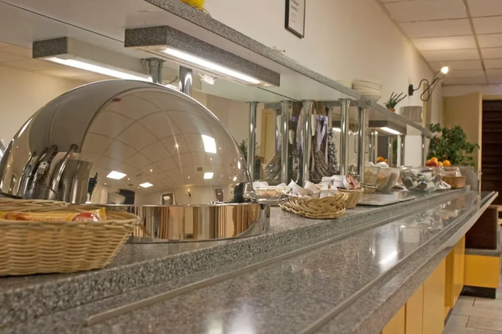 Breakfast buffet with hot dishes, breads and continental selections served at Hotel De Koopermoolen, Amsterdam.
