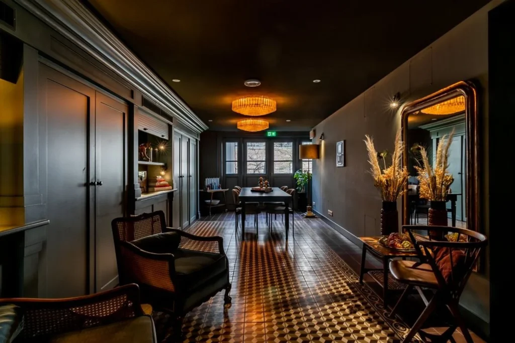 Elegant hotel lounge with stylish seating and warm lighting at Hotel Mercier in Amsterdam.
