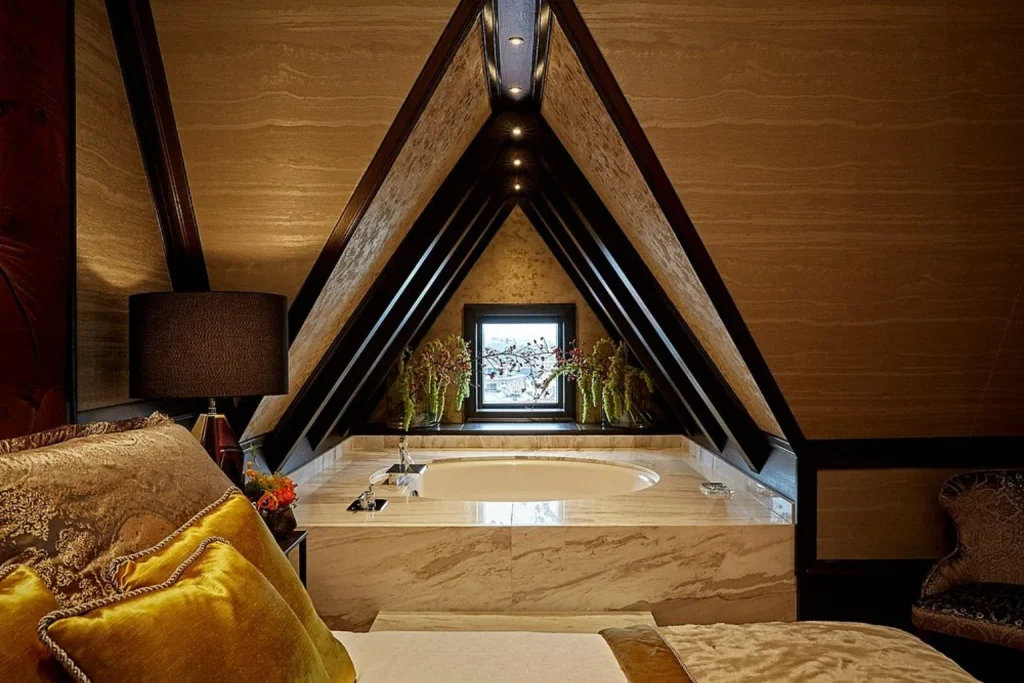 Opulent Rooftop Suite Stage featuring a marble bathtub beside the bedroom at Hotel TwentySeven, Amsterdam.