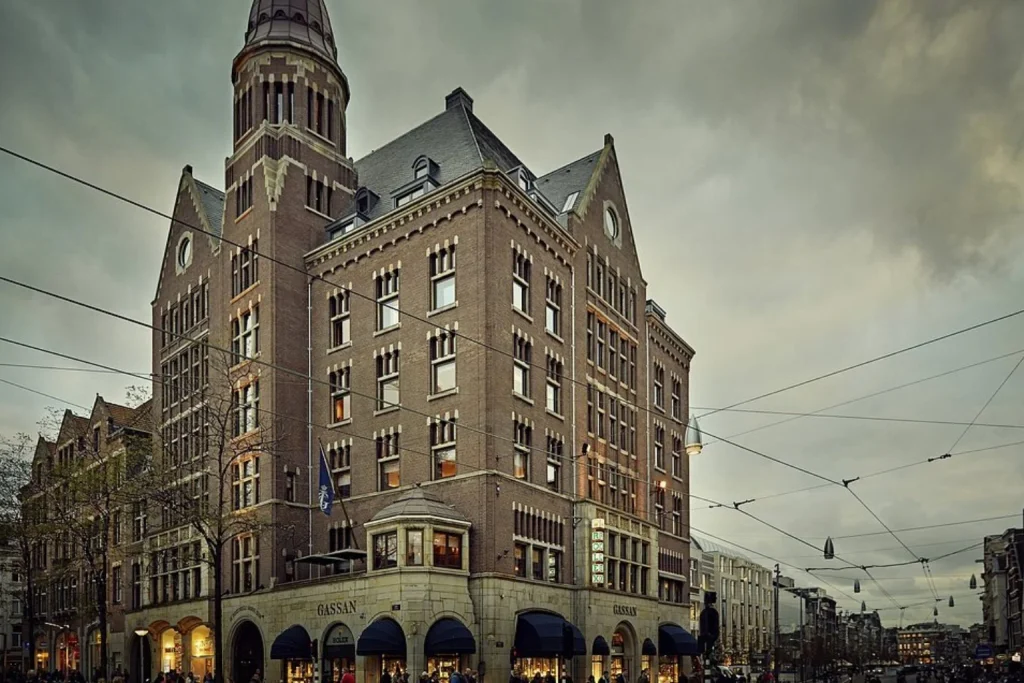 Historic landmark building with ornate brick architecture near Dam Square, Hotel TwentySeven, Amsterdam