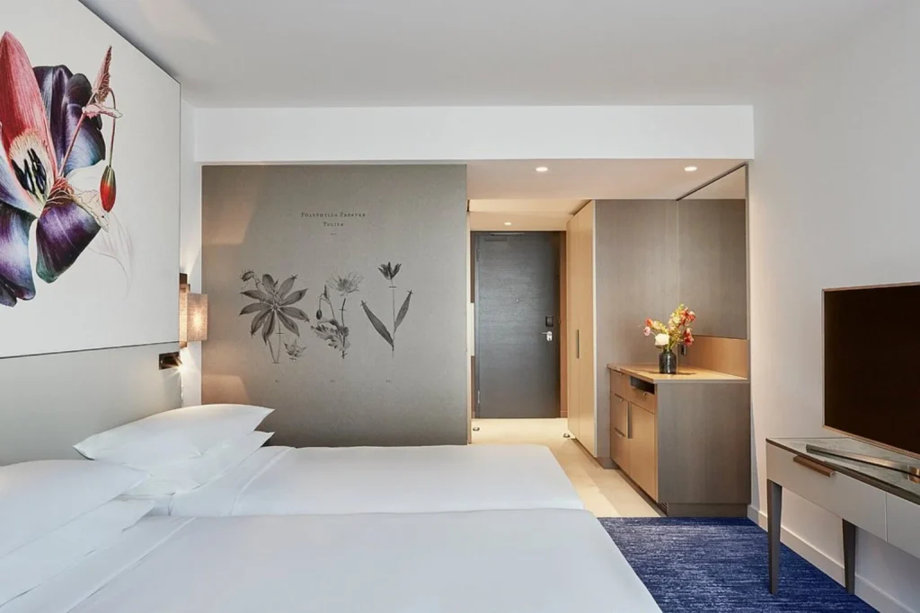 Contemporary twin room with two beds and botanical-inspired décor at Hyatt Regency Amsterdam.