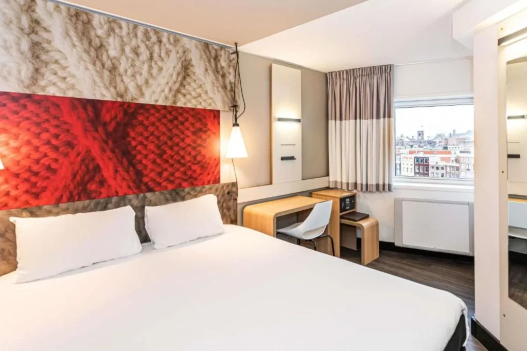 Modern standard guest room at ibis Amsterdam Centre in Amsterdam, Netherlands.