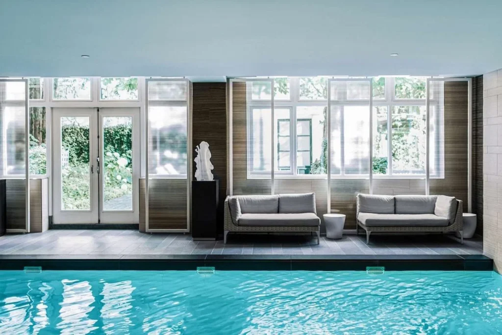 Elegant indoor swimming pool at Waldorf Astoria Amsterdam.