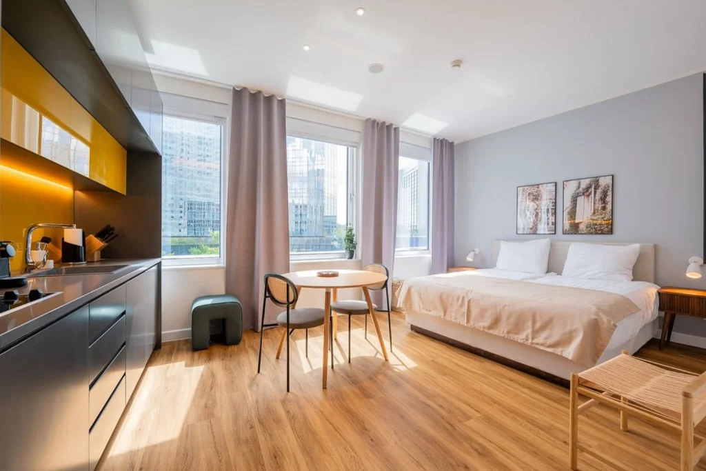 Modern studio apartment with double bed, kitchen and dining area at Limehome Amsterdam Gatwickstraat, Amsterdam
