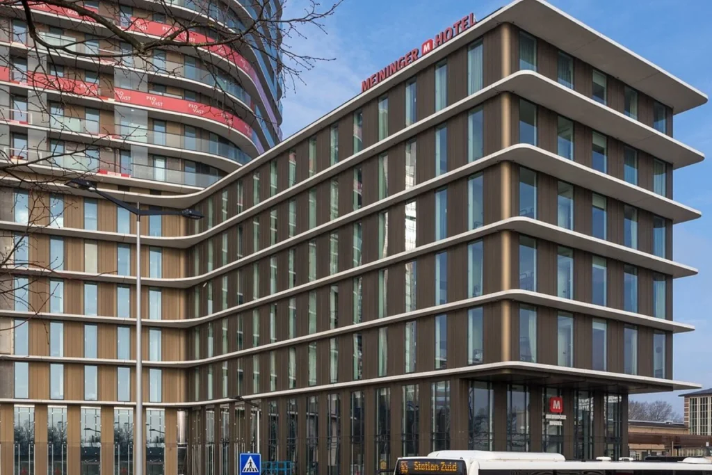 Contemporary multi-storey building with distinctive curved facade near Amstel Station at MEININGER Hotel Amsterdam Amstel, Amsterdam, Netherlands