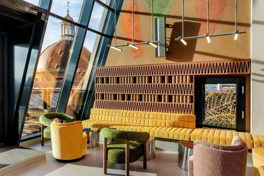 Contemporary lounge at Renaissance Amsterdam Hotel featuring colorful seating and panoramic windows