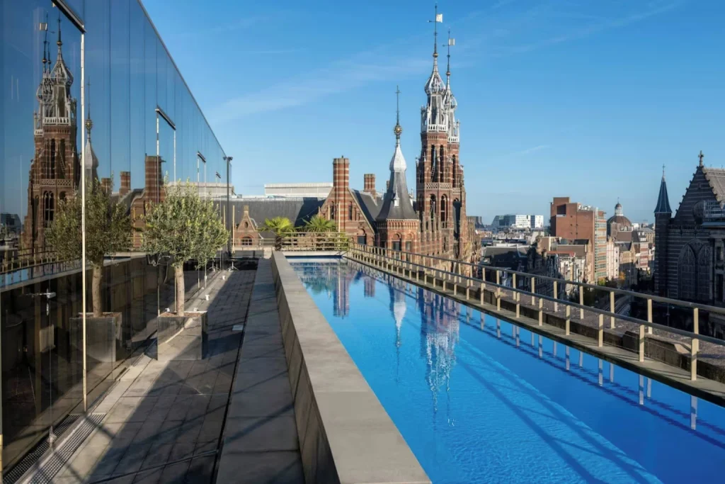 Rooftop swimming pool with panoramic views across the historic city skyline, W Amsterdam