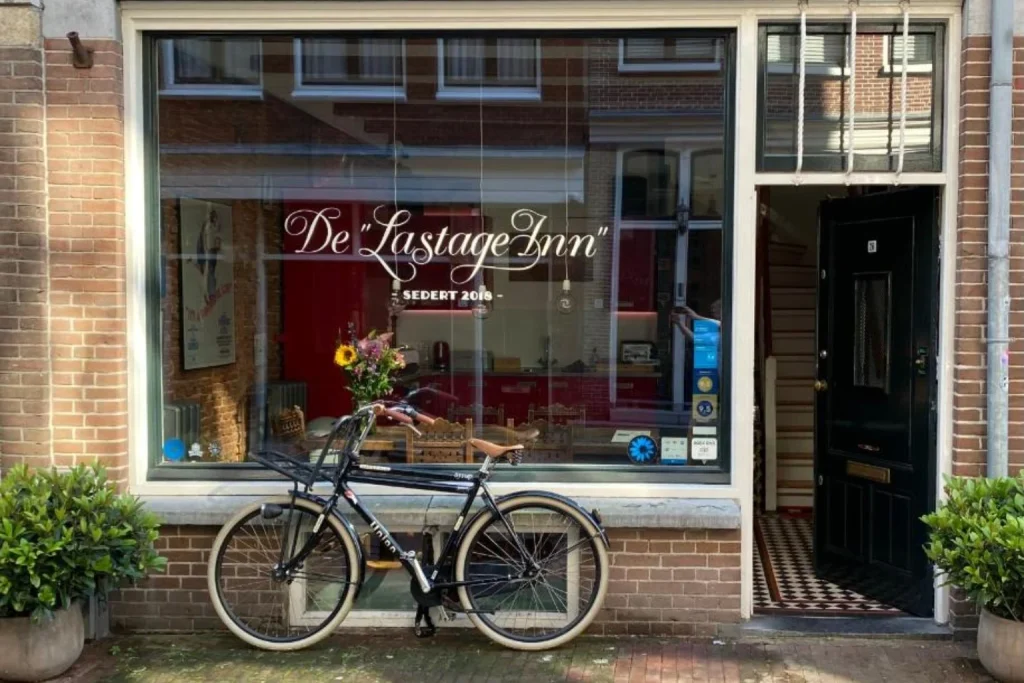 Charming brick façade, street entrance and bicycle outside The Lastage Inn Amsterdam