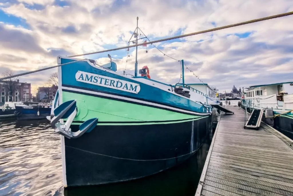 Amsterdam Hotelboat moored along the waterfront in Amsterdam