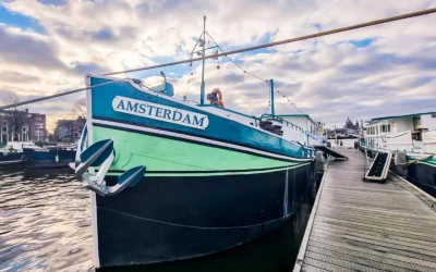 Amsterdam Hotelboat moored along the waterfront in Amsterdam