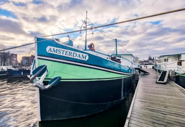 Amsterdam Hotelboat moored along the waterfront in Amsterdam