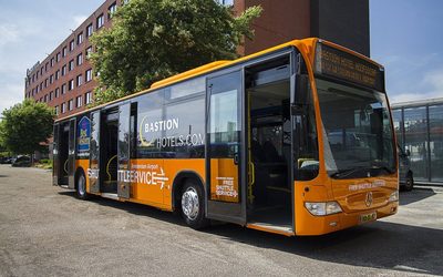 Free airport shuttle bus outside the hotel entrance at Bastion Hotel Amsterdam Airport in Amsterdam