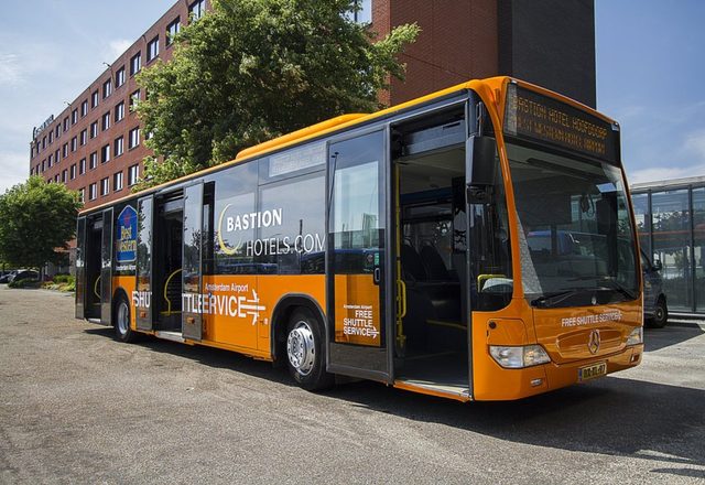 Free airport shuttle bus outside the hotel entrance at Bastion Hotel Amsterdam Airport in Amsterdam
