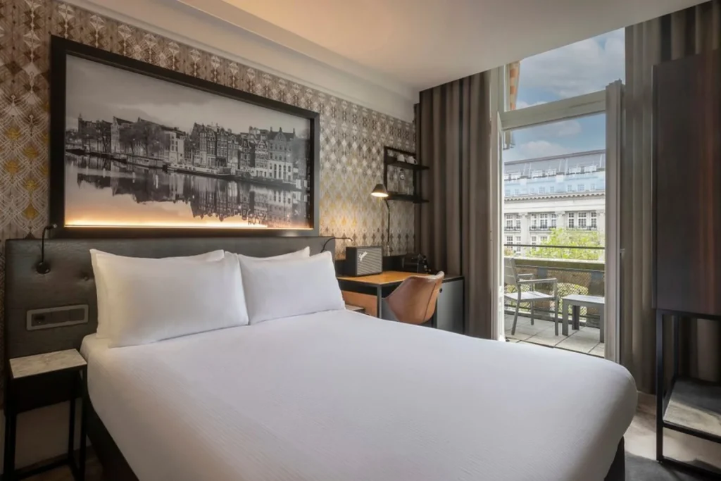 Modern guest room at Clayton Hotel Amsterdam American with private balcony