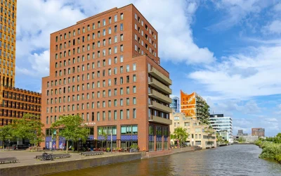 Modern waterfront exterior of Crowne Plaza Amsterdam – South overlooking a canal in Amsterdam