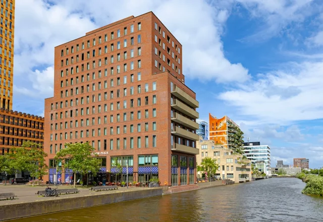Modern waterfront exterior of Crowne Plaza Amsterdam – South overlooking a canal in Amsterdam