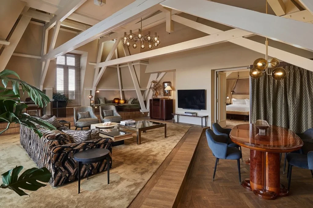 Luxury suite interior at De L’Europe Amsterdam with exposed wooden beams and elegant living area