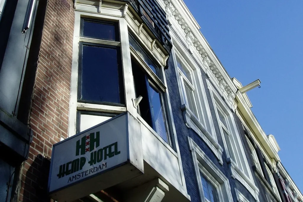 Exterior of Hemp Hotel Amsterdam with hotel sign on a traditional brick building