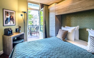 Guest room at Hotel Atlantis Amsterdam with a private balcony