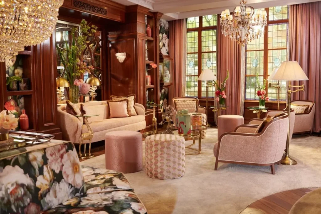 Elegant luxury lounge with floral furnishings, crystal chandeliers and stained-glass windows, Hotel Estherea, Amsterdam