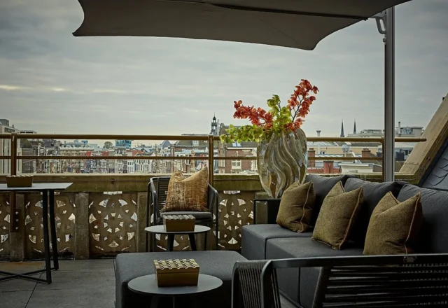 Luxury rooftop terrace with comfortable lounge seating and panoramic city views at Hotel Twenty Seven, Amsterdam