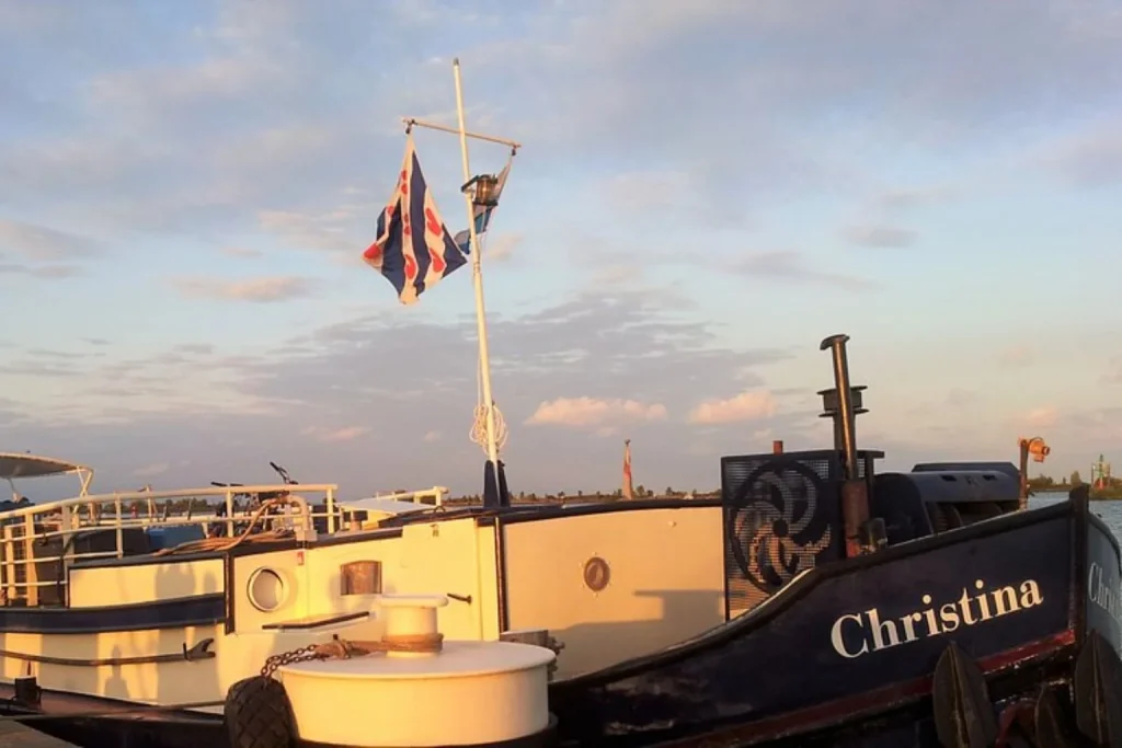 Intersail Floating Hostel Boat Avontuur moored on the waterfront in Amsterdam