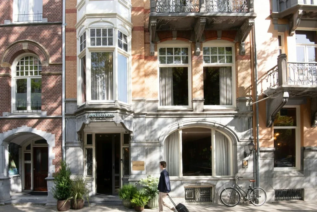 Elegant historic townhouse façade with bay windows, balconies and classic architectural details at Jan Luyken Amsterdam, Amsterdam