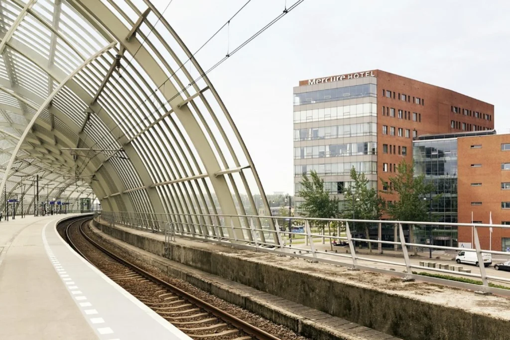 Mercure hotel building beside the modern railway platforms at Mercure Amsterdam Sloterdijk Station, Amsterdam