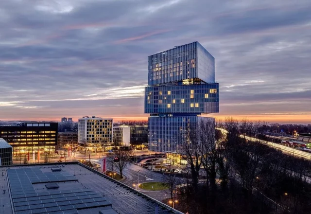 Panoramic city view across the RAI district from a high-floor guest room at nhow Amsterdam RAI, Amsterdam