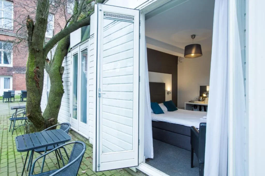 Double hotel room with direct access to a private garden terrace at Hotel Vossius Vondelpark, Amsterdam