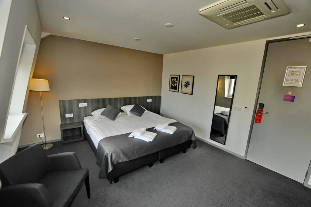 Modern double room with seating area at Parkview Hotel Amsterdam near Vondelpark, Amsterdam