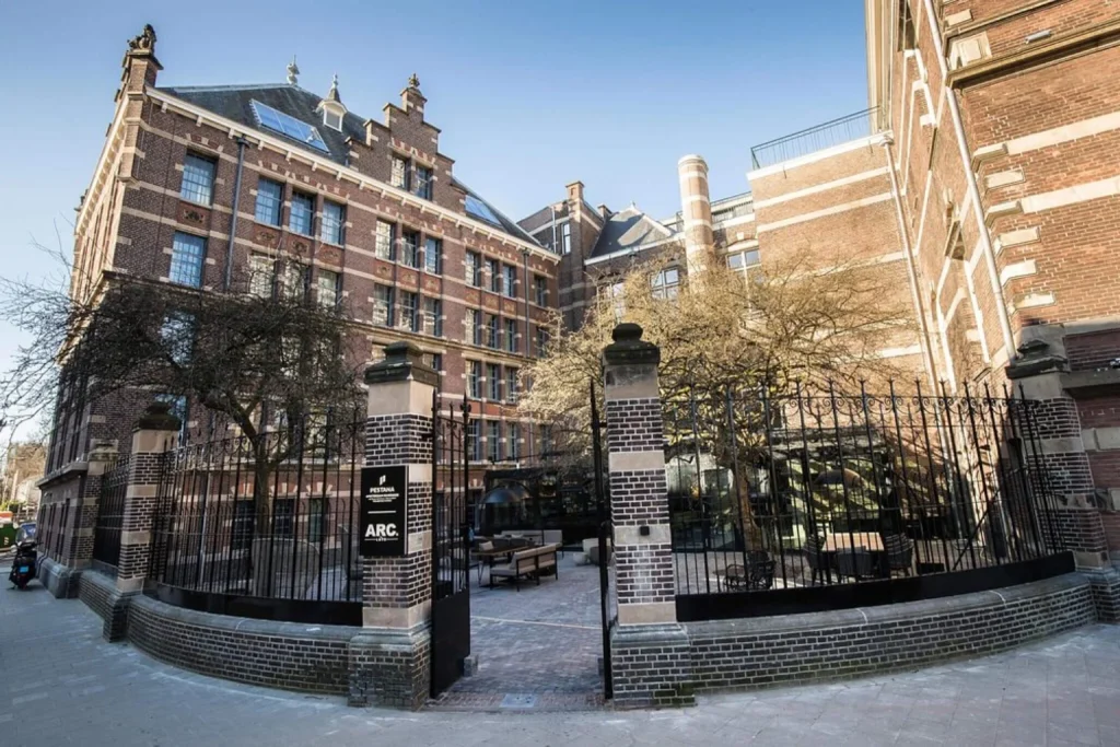 Historic luxury hotel building with courtyard at Pestana Amsterdam Riverside, Amsterdam