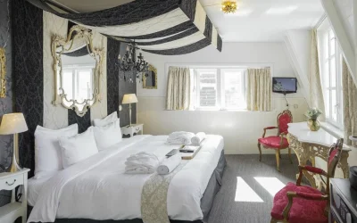 Characterful guest room with dramatic fabrics, antique-style furnishings and elegant decorative details, Rosalia’s Menagerie Inn, Amsterdam