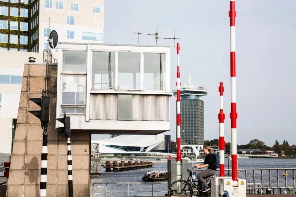 Converted bridge house accommodation overlooking an Amsterdam canal, offering a distinctive stay at SWEETS Hotel Amsterdam.