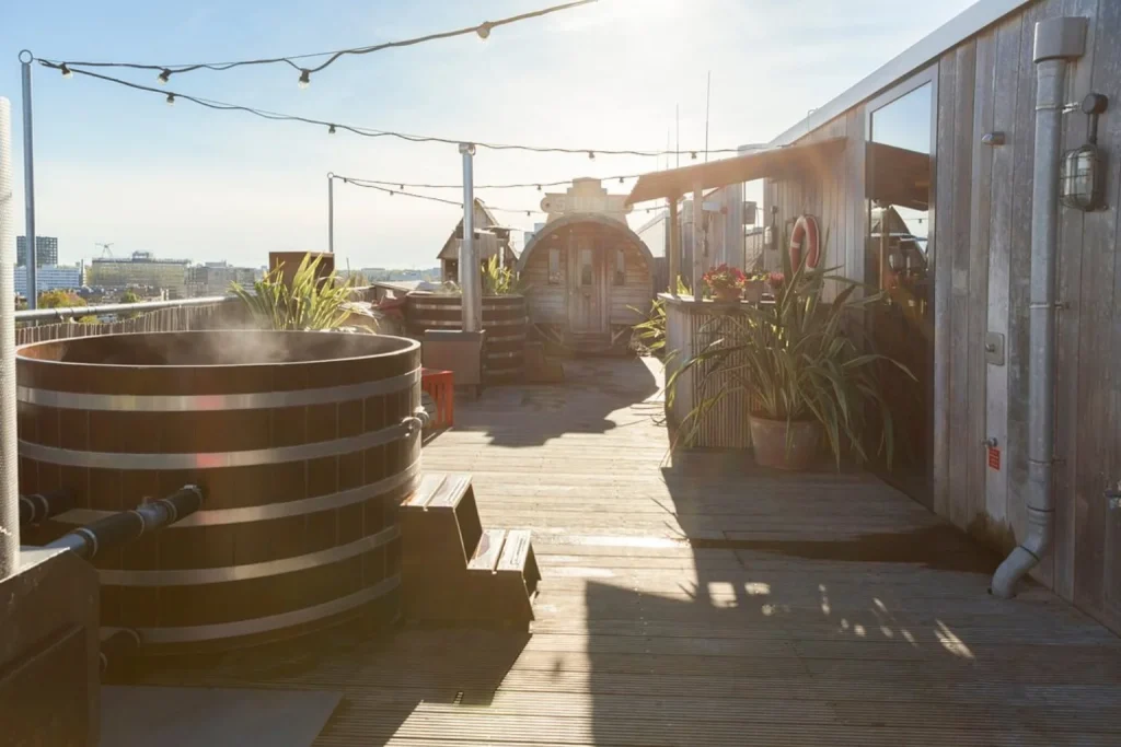 Volkshotel Amsterdam rooftop terrace with wooden hot tubs and sauna
